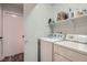 Washer and dryer in laundry room with storage shelf at 1672 Cloister Ave, Henderson, NV 89014