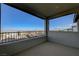 A cozy balcony showcases city views and a black railing, inviting relaxation and outdoor enjoyment at 168 Robledo St, Las Vegas, NV 89138