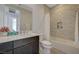 Bathroom with dark vanity, white countertop, tub-shower combo with marble-like tile at 168 Robledo St, Las Vegas, NV 89138