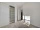 A bedroom features a closet with sliding doors, and a view to the hallway at 168 Robledo St, Las Vegas, NV 89138
