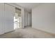 Bedroom with neutral carpet, white walls, and a closet with sliding doors at 168 Robledo St, Las Vegas, NV 89138