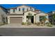 Charming two-story home showcasing a desert-landscaped front yard and a two-car garage at 168 Robledo St, Las Vegas, NV 89138