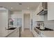 Modern kitchen with stainless steel appliances, white cabinets, and a functional layout for everyday cooking at 168 Robledo St, Las Vegas, NV 89138
