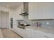 Contemporary kitchen boasting white cabinets, stainless steel appliances, gas range, and stylish backsplash at 168 Robledo St, Las Vegas, NV 89138