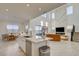Bright, open-concept living space offering modern kitchen views, stylish decor, and a grand staircase at 168 Robledo St, Las Vegas, NV 89138