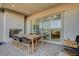 A covered patio features tile flooring, recessed lighting, and sliding glass doors at 168 Robledo St, Las Vegas, NV 89138