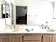 Bathroom with double sinks in vanity cabinet and a large mirror at 1812 Jack Rabbit Way, Las Vegas, NV 89128