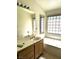 Bathroom features a soaking tub, and large vanity with sink and fixtures at 1812 Jack Rabbit Way, Las Vegas, NV 89128