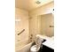 Bathroom with a combined shower and tub, white tile, and a large mirror at 1812 Jack Rabbit Way, Las Vegas, NV 89128