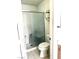 Bathroom featuring tile flooring, a toilet, and a glass shower with a built-in seat at 1812 Jack Rabbit Way, Las Vegas, NV 89128