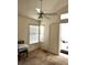 Bedroom featuring a window, ceiling fan, and access to an ensuite bathroom, providing convenience at 1812 Jack Rabbit Way, Las Vegas, NV 89128