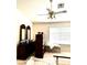 Spacious bedroom with ceiling fan, large window and bed frame on carpet at 1812 Jack Rabbit Way, Las Vegas, NV 89128