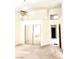 Large bedroom with a ceiling fan, mirrored closet doors, neutral carpet and walk-in closet at 1812 Jack Rabbit Way, Las Vegas, NV 89128