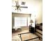 Bedroom with ceiling fan, large window and bed frame on carpet at 1812 Jack Rabbit Way, Las Vegas, NV 89128