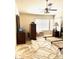 Spacious bedroom with a ceiling fan, large window and bed frame on carpet at 1812 Jack Rabbit Way, Las Vegas, NV 89128