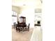 Elegant dining area featuring a classic china cabinet, dining table, and tiled flooring at 1812 Jack Rabbit Way, Las Vegas, NV 89128