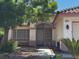 Inviting home with large front window, desert landscaping, a bench, and arched entryway at 1812 Jack Rabbit Way, Las Vegas, NV 89128