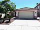 Beautiful home with a tile roof, well-maintained landscaping, and a spacious driveway leading to a two-car garage at 1812 Jack Rabbit Way, Las Vegas, NV 89128