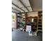 Spacious garage interior featuring ample shelving and a workbench for storage and projects at 1812 Jack Rabbit Way, Las Vegas, NV 89128