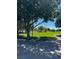Community greenspace with mature trees and lush landscaping in Pueblo Park at 1812 Jack Rabbit Way, Las Vegas, NV 89128