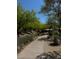 Landscaped community walking path with trees for shade at Pueblo Park community at 1812 Jack Rabbit Way, Las Vegas, NV 89128