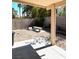 Covered patio area with concrete flooring and block wall, ideal for outdoor relaxation at 1812 Jack Rabbit Way, Las Vegas, NV 89128