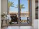 Relaxing balcony with rocking chairs and a stunning lake view at 20 Via Mantova # 208, Henderson, NV 89011