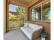Inviting balcony with seating area and views of lush greenery and nearby buildings at 20 Via Mantova # 208, Henderson, NV 89011