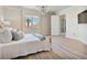 Spacious bedroom features wood floors, scenic views, and an elegant chandelier at 20 Via Mantova # 208, Henderson, NV 89011