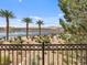 Scenic lake view from a balcony showcasing palm trees and desert plants at 20 Via Mantova # 208, Henderson, NV 89011