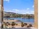 Beautiful lake view showcasing waterfront homes and a mountain backdrop at 20 Via Mantova # 208, Henderson, NV 89011