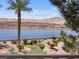Beautiful lake view from balcony featuring desert landscaping and a walking path at 20 Via Mantova # 208, Henderson, NV 89011