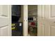 A convenient laundry area with a stackable washer and dryer and built-in shelving for storage at 20 Via Mantova # 208, Henderson, NV 89011