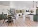 Open-concept living space showcases hardwood floors, a fireplace, and an airy ambiance at 20 Via Mantova # 208, Henderson, NV 89011