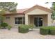 Single-story home with a private patio area and neatly trimmed landscaping and tile roof at 2013 Capestone St, Las Vegas, NV 89134