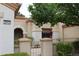 Inviting front entrance with gated courtyard and desert landscaping features at 2013 Capestone St, Las Vegas, NV 89134