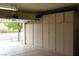 Spacious garage with custom cabinets, offering ample storage space and organization at 2013 Capestone St, Las Vegas, NV 89134