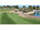 Beautiful golf course with a lake and green grass at 2013 Capestone St, Las Vegas, NV 89134