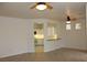 Bright living room with views into the kitchen and a cozy breakfast bar at 2013 Capestone St, Las Vegas, NV 89134