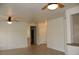 Open living space featuring tile flooring, ceiling fans, and neutral paint scheme at 2013 Capestone St, Las Vegas, NV 89134