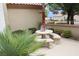 Outdoor patio features a stone table with bench seating, perfect for al fresco dining at 2013 Capestone St, Las Vegas, NV 89134