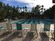 Relaxing community pool area with comfortable lounge chairs and inviting blue water at 2013 Capestone St, Las Vegas, NV 89134