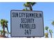 Sign indicating Sun City Summerlin is security patrolled 24/7, promoting a safe and secure community environment at 2013 Capestone St, Las Vegas, NV 89134