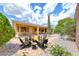 Inviting backyard oasis with a charming fire pit and comfortable seating, perfect for outdoor relaxation at 2056 Oliver Springs St, Henderson, NV 89052