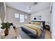 Bright bedroom featuring hardwood floors and stylish modern furniture at 2056 Oliver Springs St, Henderson, NV 89052
