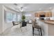 Cozy breakfast nook with bar seating, view of modern kitchen, and large windows at 2056 Oliver Springs St, Henderson, NV 89052