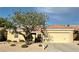 Inviting single-story home featuring a well-maintained yard and mature landscaping at 2056 Oliver Springs St, Henderson, NV 89052
