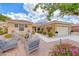 Charming single-story home with landscaped front yard and inviting outdoor seating area at 2056 Oliver Springs St, Henderson, NV 89052