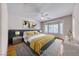 Bright main bedroom featuring a large bay window, ceiling fan, and neutral decor at 2056 Oliver Springs St, Henderson, NV 89052