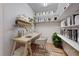Home office featuring stylish desk, ample shelving, and natural light at 2056 Oliver Springs St, Henderson, NV 89052